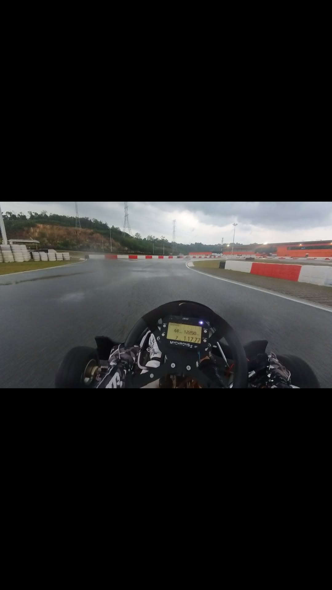 Wet KZ2 onboard view during a rainy track session